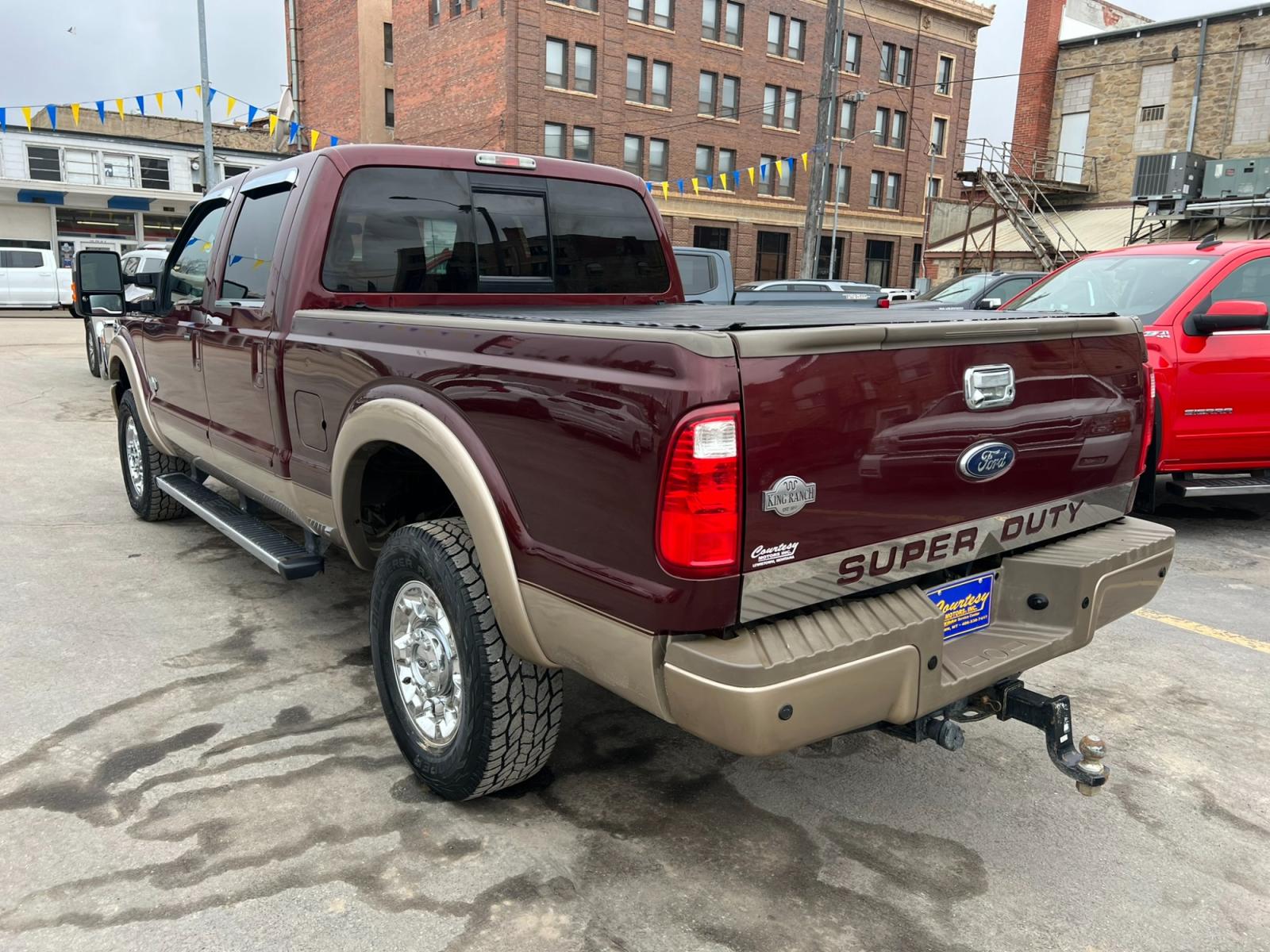 2012 Maroon /Brown Ford F-350 SD King Ranch (1FT8W3BT7CE) with an 6.7L V8 F OHV 32V DIESEL engine, Automatic transmission, located at 116 5th Avenue South, Lewistown, MT, 59457, 47.063877, -109.427879 - Introducing the ultimate combination of power and luxury – the 2012 Ford F350 Crew Cab King Ranch 4x4. With its robust Powerstroke diesel engine, this truck is built to handle anything you throw at it. Whether you're towing a trailer or cruising around town, the F350 delivers top-notch performance - Photo #4